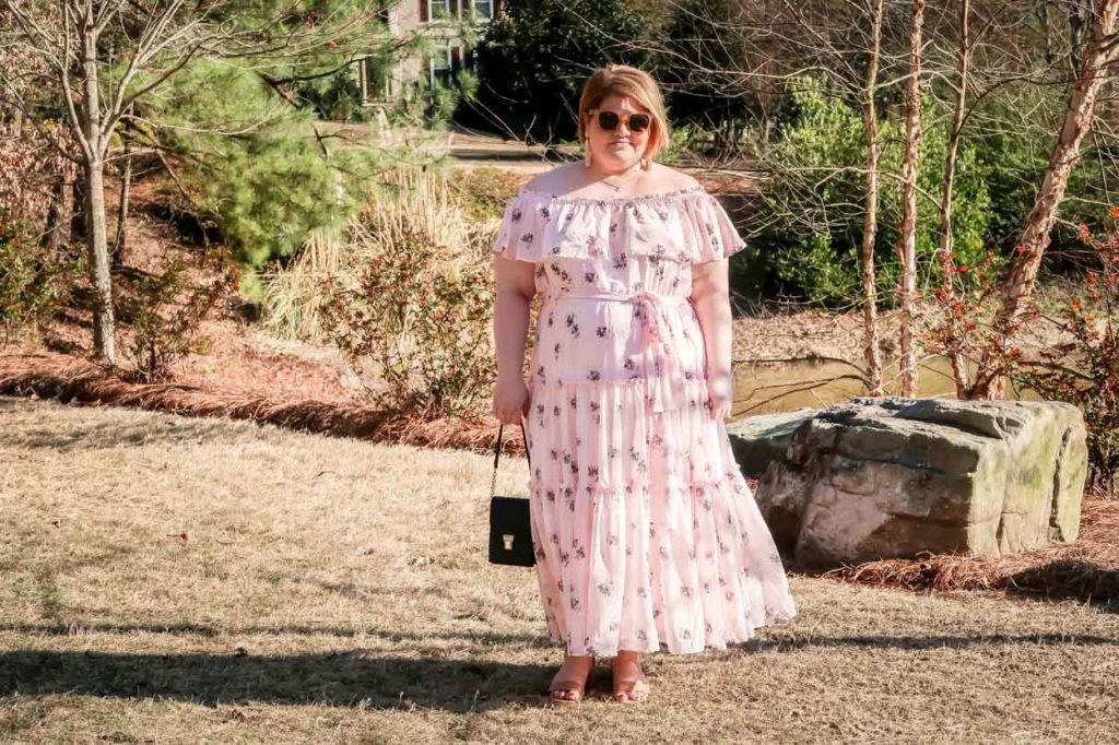 Lane Bryant Off The Shoulder Ruffled Maxi Dress with black purse in front of trees