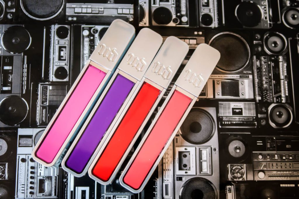 Lip Glosses On Top of a Cassette Player Pattern