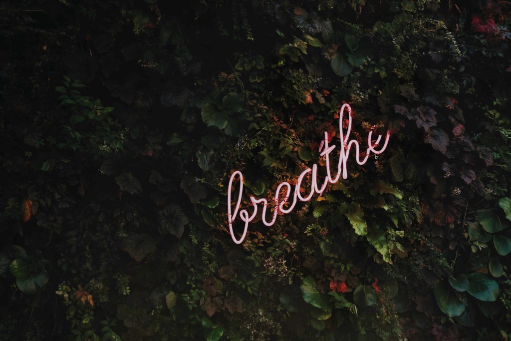 Coronavirus and Self Care. Just breathe neon sign