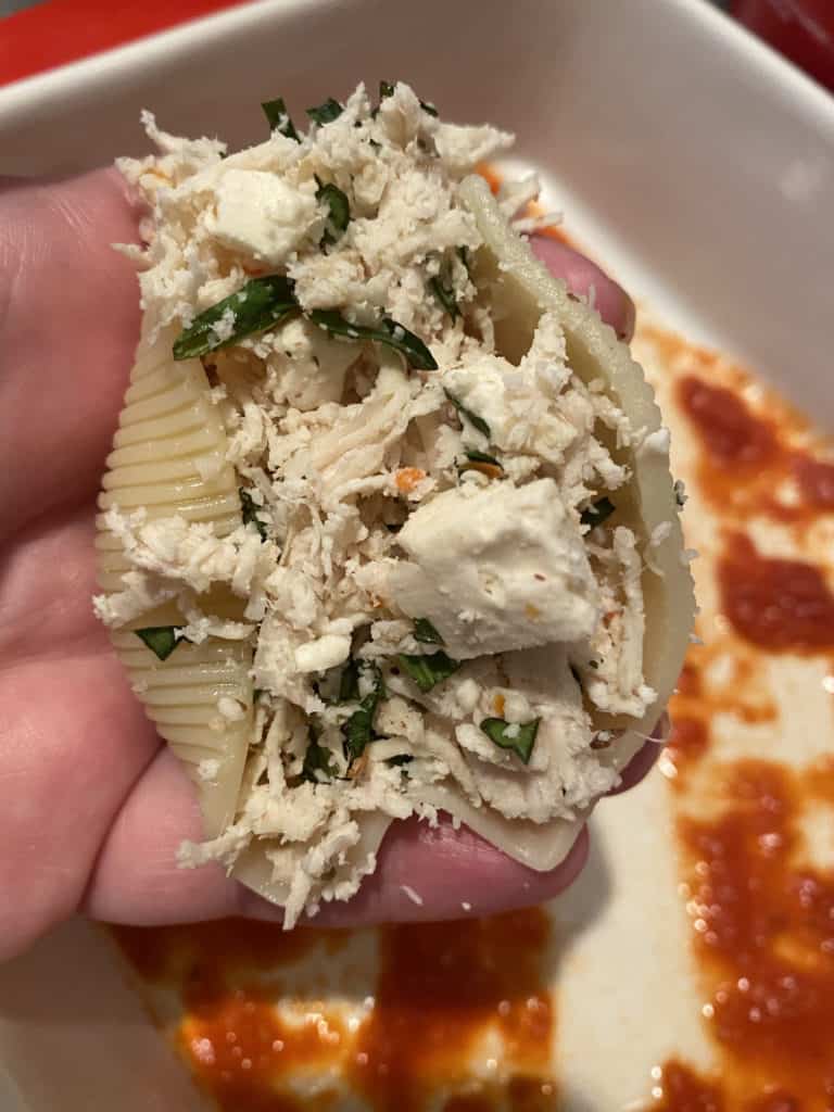 Stuffed Shells Filling includes feta cheese, roasted chicken, mozzarella, parmesan and basil