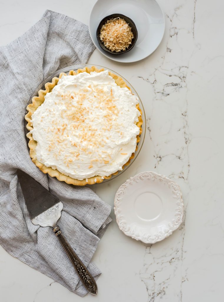 Pie and serving dish on table for Thanksgiving 